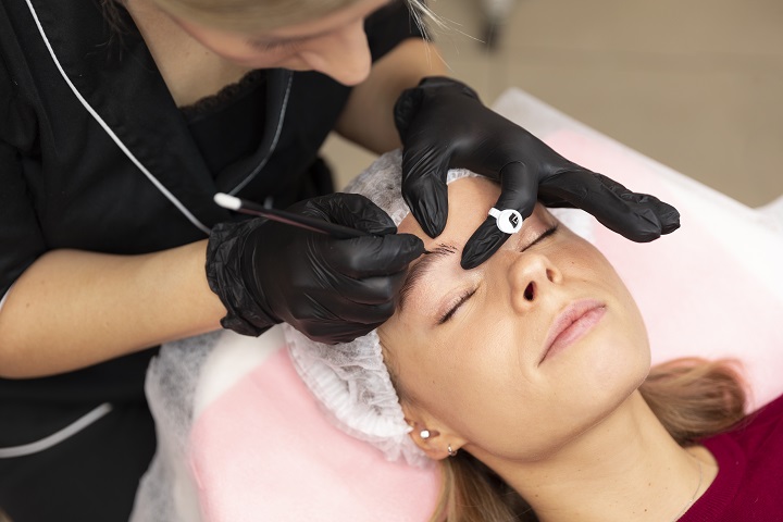 A young-woman through-lash and brow tint-treatment